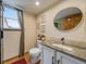 Charming bathroom with granite countertop, oval mirror, and natural light from a window at 9251 Sand Hill Trl, Highlands Ranch, CO 80126