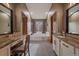 Large bathroom with dual vanities, soaking tub, and lots of counter space at 9251 Sand Hill Trl, Highlands Ranch, CO 80126