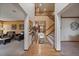 Inviting home entryway with wood floors, staircase, and open access to living room and other areas at 9251 Sand Hill Trl, Highlands Ranch, CO 80126