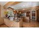 Spacious kitchen with granite countertops, an island, stainless appliances, and wooden cabinets at 9251 Sand Hill Trl, Highlands Ranch, CO 80126