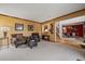 Inviting living room with comfortable seating, warm colors, and an open view to the dining room at 9251 Sand Hill Trl, Highlands Ranch, CO 80126