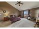 Comfortable primary bedroom featuring a vaulted ceiling, ceiling fan, and ample space at 9251 Sand Hill Trl, Highlands Ranch, CO 80126