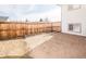 Backyard space with gravel and wooden planters bordered by a wood fence is great for relaxing or gardening at 441 Elbert Way, Denver, CO 80221