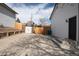 Spacious backyard with a wooden fence, featuring a shed and ample parking at 441 Elbert Way, Denver, CO 80221