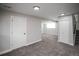 Finished basement area features neutral paint, new carpet and fixtures, providing a cozy and versatile living space at 441 Elbert Way, Denver, CO 80221