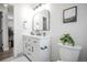 Bright bathroom features white vanity, black fixtures, and lots of natural light at 441 Elbert Way, Denver, CO 80221