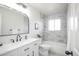 Bright bathroom features marble tiling, modern fixtures, and lots of natural light at 441 Elbert Way, Denver, CO 80221