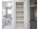 Bathroom & bedroom view through closet with built in shelving at 441 Elbert Way, Denver, CO 80221