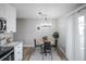 Bright dining area features a round table with modern chairs and stylish light fixture at 441 Elbert Way, Denver, CO 80221