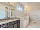 Bathroom with granite countertop, bath, and a window providing natural light at 812 Mulberry St, Louisville, CO 80027
