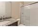 Bathroom featuring granite vanity and a modern glass-enclosed shower at 812 Mulberry St, Louisville, CO 80027