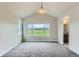 Bright bedroom featuring large windows with scenic views and plush carpeting at 812 Mulberry St, Louisville, CO 80027