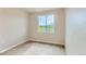 Bright, empty bedroom with large window, laminate wood flooring and neutral paint, ready for customization at 812 Mulberry St, Louisville, CO 80027