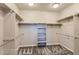 Walk-in closet with ample shelving and hanging space for organized storage at 812 Mulberry St, Louisville, CO 80027