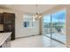 Dining area featuring a stylish chandelier and sliding glass doors that lead to a patio with scenic views at 812 Mulberry St, Louisville, CO 80027