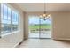 Bright dining area with large windows and glass doors offering picturesque views of a lush green field at 812 Mulberry St, Louisville, CO 80027