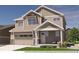 Charming two-story home with a two-car garage and inviting front porch at 812 Mulberry St, Louisville, CO 80027
