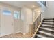 Inviting foyer with a staircase and neutral-toned walls, leading to the upper level at 812 Mulberry St, Louisville, CO 80027