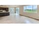 Bright living room with wood-look floors, adjacent to the modern kitchen and outdoor view at 812 Mulberry St, Louisville, CO 80027