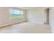 Bright living room with wood-look floors and a large window showcasing the outdoor view at 812 Mulberry St, Louisville, CO 80027