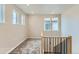 Loft area with natural light, complemented by staircase with modern railings at 812 Mulberry St, Louisville, CO 80027