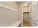 Mudroom includes a bench, coat hooks, and closet for organization near the entry at 812 Mulberry St, Louisville, CO 80027