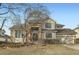 Charming two-story home featuring a combination of siding and brick exterior with a well-manicured lawn at 14045 E Grand Ave, Aurora, CO 80015