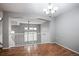 Open dining area showcasing hardwood floors and a decorative chandelier at 1473 Red Cliff Way, Castle Rock, CO 80109