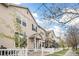Charming townhouse exteriors along a tree-lined street, featuring well-kept lawns and picket fences at 1473 Red Cliff Way, Castle Rock, CO 80109