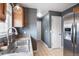Galley kitchen features stainless steel appliances and a view into an adjacent hallway at 1473 Red Cliff Way, Castle Rock, CO 80109