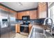 Well-equipped kitchen with stainless steel appliances and ample counter space at 1473 Red Cliff Way, Castle Rock, CO 80109