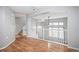 A living room features hardwood floors, a staircase, and white railings at 1473 Red Cliff Way, Castle Rock, CO 80109