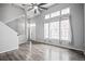 Bright living room with vaulted ceilings, large windows, and modern gray flooring at 1473 Red Cliff Way, Castle Rock, CO 80109
