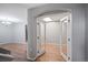 Bright office with french doors and wood floors, adjacent to a living room area at 1473 Red Cliff Way, Castle Rock, CO 80109