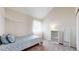 Comfortable bedroom features soft carpeting, natural light, and neutral walls at 12368 W Nevada Pl # 303, Lakewood, CO 80228