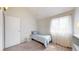 Bright bedroom features plush carpeting, natural light, and neutral walls at 12368 W Nevada Pl # 303, Lakewood, CO 80228