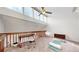 Bonus room featuring large windows, modern ceiling fan, and hardwood railing at 12368 W Nevada Pl # 303, Lakewood, CO 80228