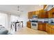 Bright kitchen features stainless steel appliances, mosaic backsplash, and dining area with lots of natural light at 12368 W Nevada Pl # 303, Lakewood, CO 80228
