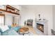 Open-concept living area with a fireplace, sectional couch, and staircase leading to the upper level at 12368 W Nevada Pl # 303, Lakewood, CO 80228