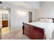Cozy main bedroom exhibits plush carpeting, generous natural light, and easy access to the en-suite bathroom at 12368 W Nevada Pl # 303, Lakewood, CO 80228