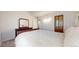 Comfortable main bedroom showcases ample space, plush carpeting, and elegant wooden accents at 12368 W Nevada Pl # 303, Lakewood, CO 80228
