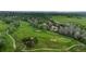 Aerial view of the community golf course, showing the lush green fairways and surrounding neighborhood at 298 S Hoover Ave, Louisville, CO 80027