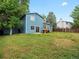 Spacious backyard with mature trees providing plenty of shade at 298 S Hoover Ave, Louisville, CO 80027