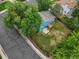 Aerial view of a blue home with a wooden deck and a fenced backyard, showcasing its outdoor space at 298 S Hoover Ave, Louisville, CO 80027