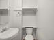 Bright and minimalist bathroom design with a vessel sink and toilet at 298 S Hoover Ave, Louisville, CO 80027