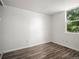 Bedroom with wood-look floors, white walls and natural light at 298 S Hoover Ave, Louisville, CO 80027