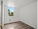 Bright bedroom with wood floors, a window and white walls at 298 S Hoover Ave, Louisville, CO 80027