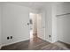 Bedroom featuring wood-look floors, white walls and closet at 298 S Hoover Ave, Louisville, CO 80027