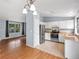 Well-lit kitchen featuring white cabinets, stainless steel appliances, wood countertops, and tile floors at 298 S Hoover Ave, Louisville, CO 80027
