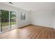 Bright living room with wood floors, a sliding glass door and view to the backyard at 298 S Hoover Ave, Louisville, CO 80027